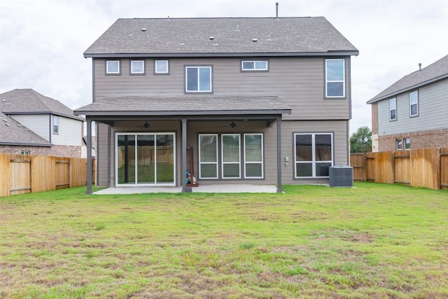 103 Periwinkle Ln, Bastrop, TX 78602 - rear view of house with a fenced backyard, a patio, and a shingled roof