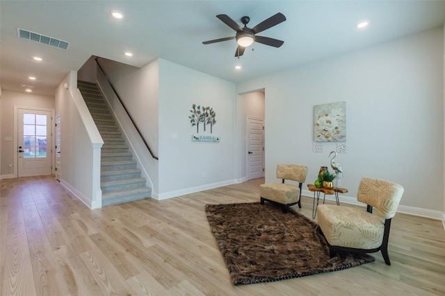 103 Periwinkle Ln, Bastrop, TX 78602 - sitting room featuring light wood-style flooring, stairway, a ceiling fan, and recessed lighting