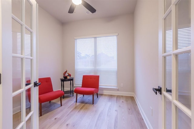 103 Periwinkle Ln, Bastrop, TX 78602 - living area featuring french doors, wood finished floors, and ceiling fan