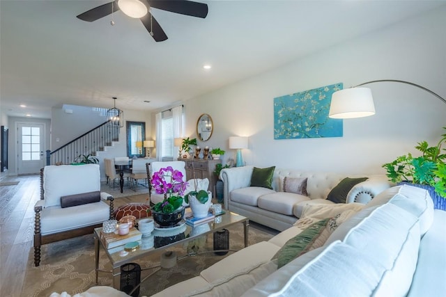 126 Periwinkle Ln, Bastrop, TX 78602 - living area featuring stairs, wood finished floors, recessed lighting, and a ceiling fan