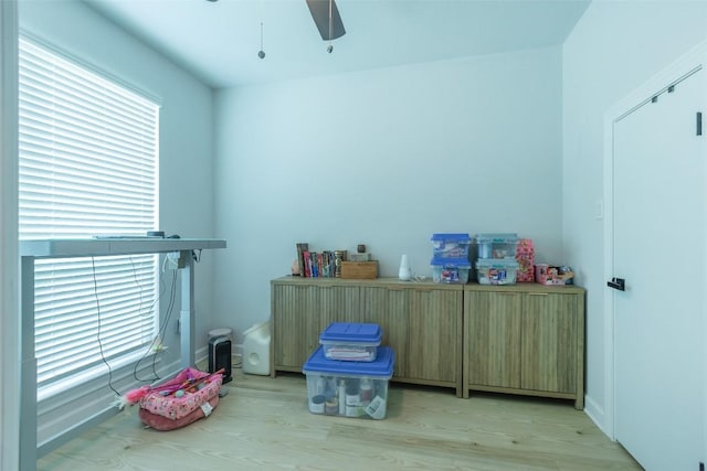 126 Periwinkle Ln, Bastrop, TX 78602 - miscellaneous room with light wood-type flooring and a ceiling fan
