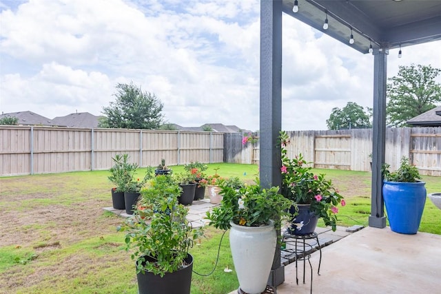 126 Periwinkle Ln, Bastrop, TX 78602 - fenced backyard featuring a patio area