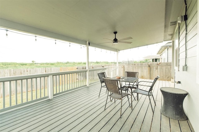 324 Millbrook Blvd, San Marcos, TX 78666 - wooden terrace with a fenced backyard, outdoor dining area, and ceiling fan