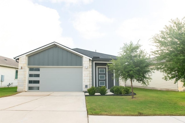 324 Millbrook Blvd, San Marcos, TX 78666 - view of front facade featuring board and batten siding, concrete driveway, a garage, and a front lawn