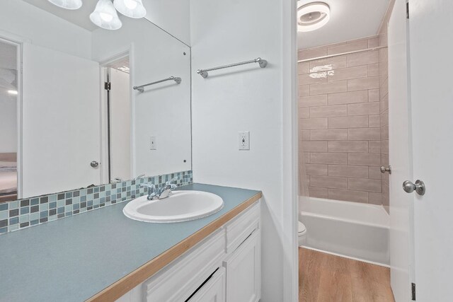 1240 Barton Hills Dr Unit 114, Austin, TX 78704 - bathroom featuring vanity, wood finished floors, and tub / shower combination
