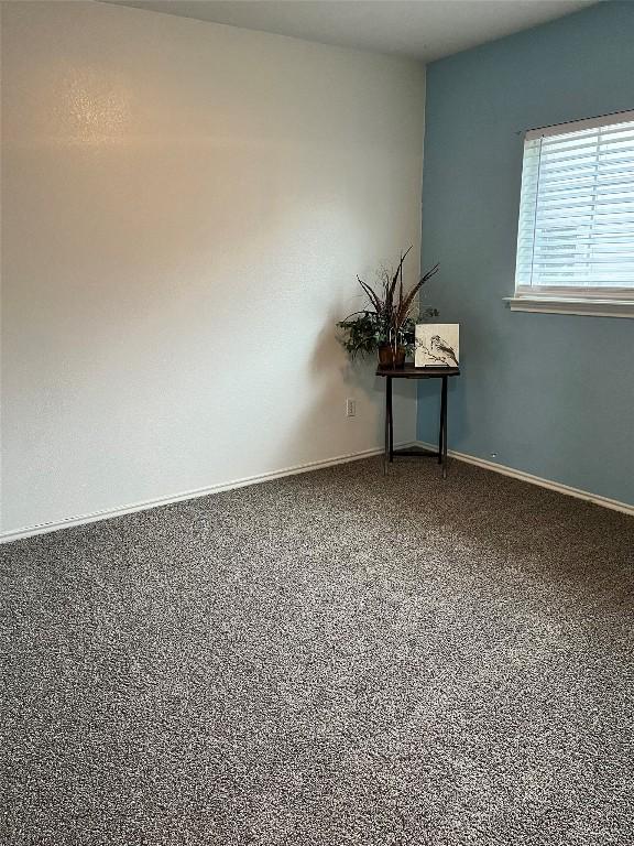 108 Bexar Forest Cv, Elgin, TX 78621 - carpeted spare room featuring baseboards