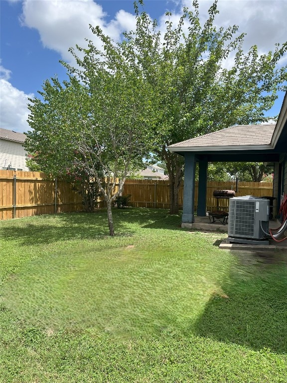 108 Bexar Forest Cv, Elgin, TX 78621 - fenced backyard with a patio area