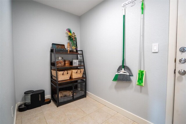 1410 Sherry Dr, Taylor, TX 76574 - misc room with baseboards and light tile patterned flooring