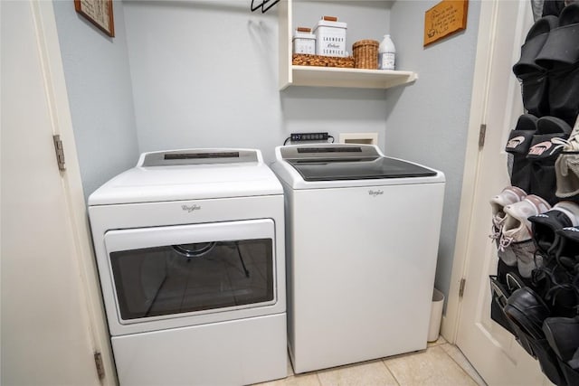 1410 Sherry Dr, Taylor, TX 76574 - laundry room featuring washing machine and clothes dryer and light tile patterned floors