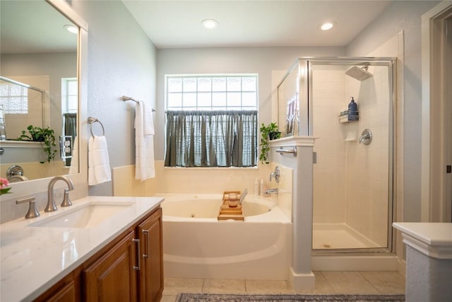 1410 Sherry Dr, Taylor, TX 76574 - full bathroom with a tub with jets, a shower stall, vanity, plenty of natural light, and recessed lighting