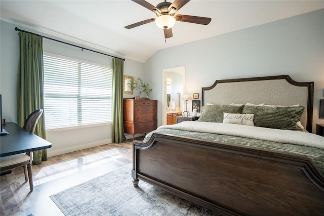 1410 Sherry Dr, Taylor, TX 76574 - bedroom featuring vaulted ceiling, a ceiling fan, and connected bathroom