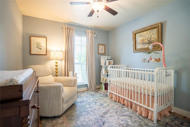 1410 Sherry Dr, Taylor, TX 76574 - bedroom featuring a nursery area and ceiling fan