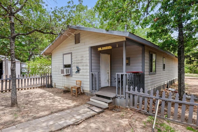 147 Sunset Hts, Bastrop, TX 78602 - view of front facade featuring cooling unit and a shed