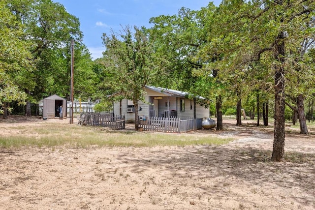 147 Sunset Hts, Bastrop, TX 78602 - view of front facade featuring a storage unit