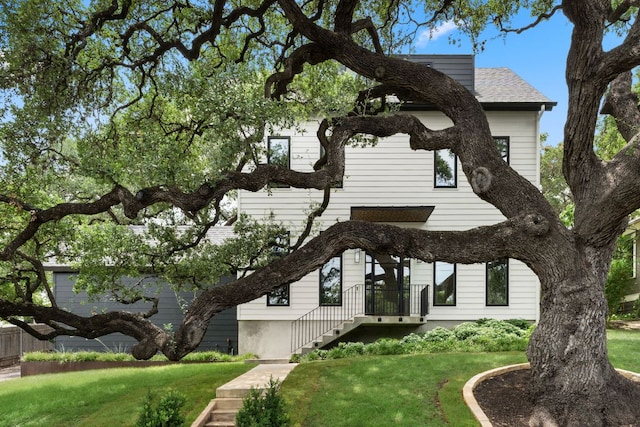 606 Augusta Ave Unit 1, Austin, TX 78703 - view of front of property with a front yard and roof with shingles