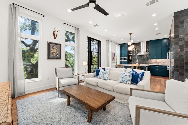 606 Augusta Ave Unit 1, Austin, TX 78703 - living area featuring light wood-type flooring, healthy amount of natural light, ceiling fan, and recessed lighting