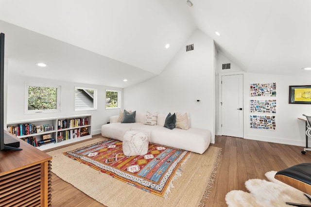 606 Augusta Ave Unit 1, Austin, TX 78703 - living room with wood finished floors, vaulted ceiling, and recessed lighting