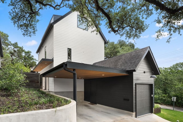 606 Augusta Ave Unit 1, Austin, TX 78703 - view of side of home featuring roof with shingles