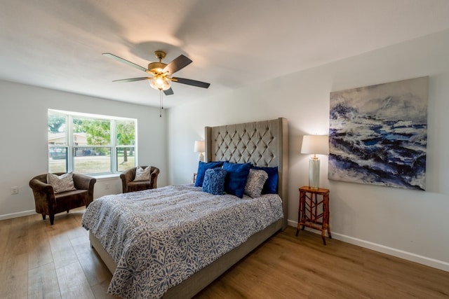 106 Heron, Highland Haven, TX 78654 - bedroom with wood finished floors and a ceiling fan