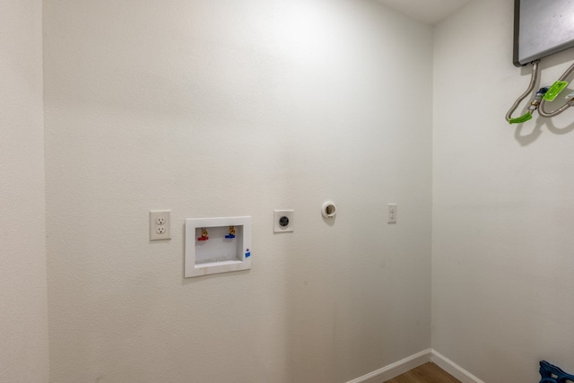 106 Heron, Highland Haven, TX 78654 - laundry room with electric dryer hookup, wood finished floors, and washer hookup