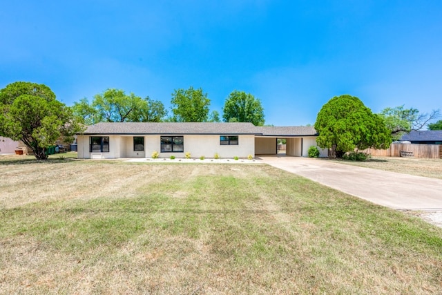 106 Heron, Highland Haven, TX 78654 - ranch-style house with driveway, a front yard, and a carport