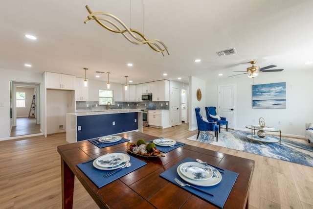 106 Heron, Highland Haven, TX 78654 - dining area featuring light wood-style flooring, recessed lighting, and a ceiling fan