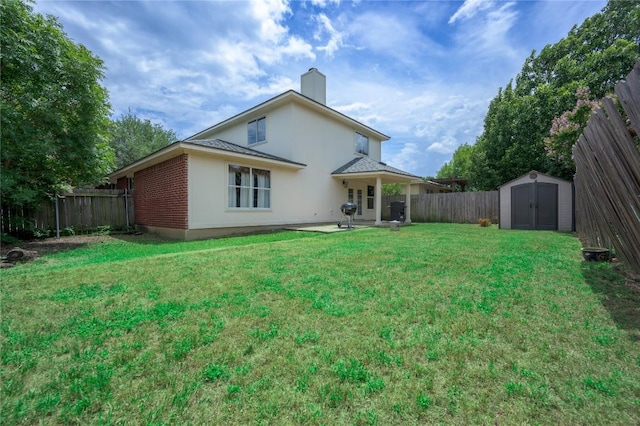 207 Presidio Dr, Leander, TX 78641 - rear view of property with a storage unit, a fenced backyard, a chimney, and brick siding