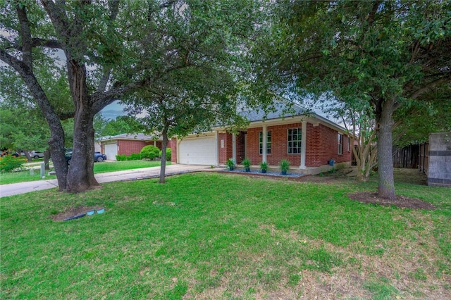 207 Presidio Dr, Leander, TX 78641 - ranch-style home featuring concrete driveway, an attached garage, a front lawn, and brick siding