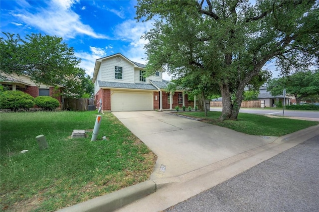 207 Presidio Dr, Leander, TX 78641 - traditional-style house featuring brick siding, an attached garage, and concrete driveway