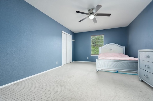 207 Presidio Dr, Leander, TX 78641 - bedroom featuring carpet flooring, a closet, ceiling fan, and a textured wall
