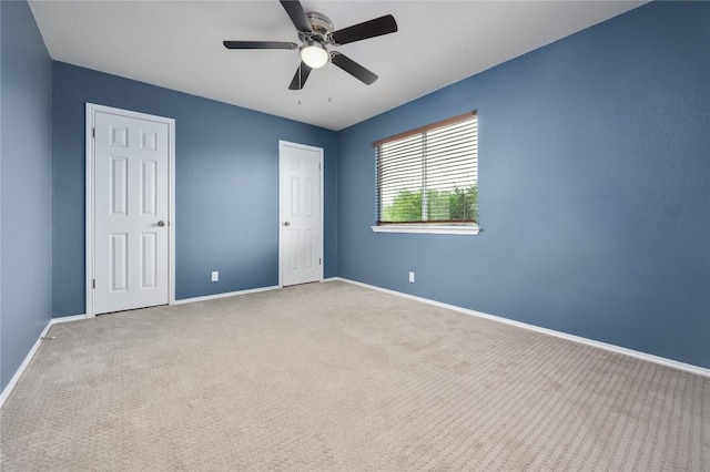 207 Presidio Dr, Leander, TX 78641 - unfurnished bedroom featuring carpet and a ceiling fan