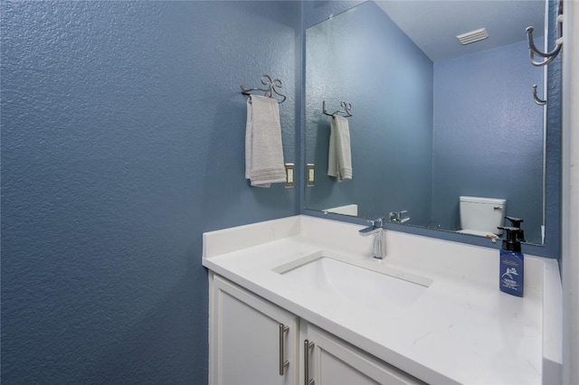 207 Presidio Dr, Leander, TX 78641 - bathroom with a textured wall and vanity