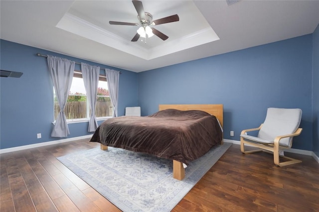 207 Presidio Dr, Leander, TX 78641 - bedroom featuring a raised ceiling, wood finished floors, crown molding, and ceiling fan