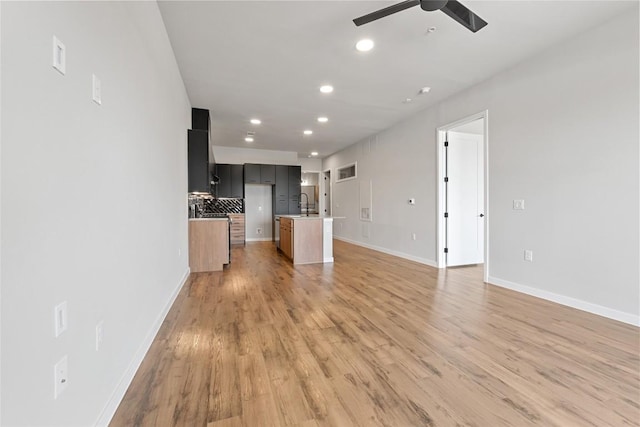 4510 Terry-O Ln Unit 415, Austin, TX 78745 - unfurnished living room featuring recessed lighting, ceiling fan, and light wood-style flooring