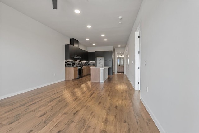 4510 Terry-O Ln Unit 415, Austin, TX 78745 - unfurnished living room with recessed lighting and light wood-style flooring