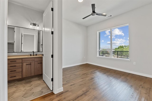 4510 Terry-O Ln Unit 415, Austin, TX 78745 - unfurnished bedroom featuring wood finished floors and ensuite bath