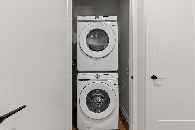 4510 Terry-O Ln Unit 415, Austin, TX 78745 - washroom featuring stacked washer and clothes dryer and wood finished floors