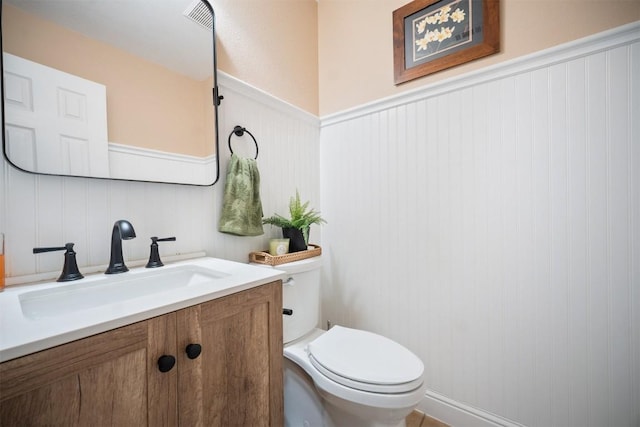 1215 Boerne Dr, Cedar Park, TX 78613 - bathroom with vanity, wainscoting, and a decorative wall