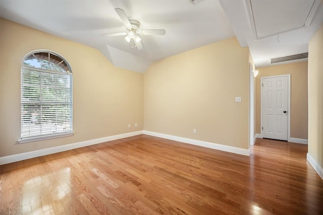 1215 Boerne Dr, Cedar Park, TX 78613 - unfurnished room featuring attic access, light wood-style flooring, a ceiling fan, and lofted ceiling