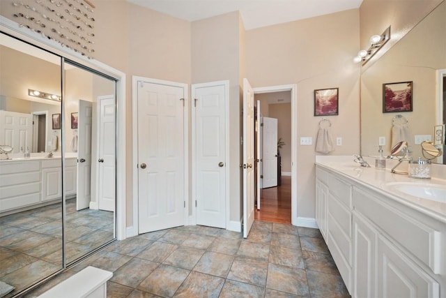 1215 Boerne Dr, Cedar Park, TX 78613 - bathroom featuring double vanity and stone finish floors