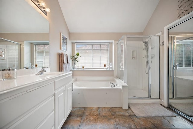 1215 Boerne Dr, Cedar Park, TX 78613 - full bathroom featuring vaulted ceiling, vanity, a bath, and a shower stall