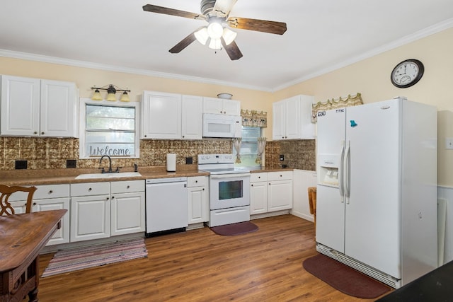 429 W 4th St, Flatonia, TX 78941 - kitchen with white appliances, ornamental molding, decorative backsplash, and white cabinets