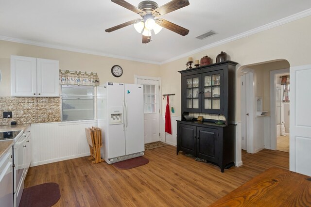 429 W 4th St, Flatonia, TX 78941 - kitchen featuring white appliances, light wood finished floors, a ceiling fan, crown molding, and tasteful backsplash