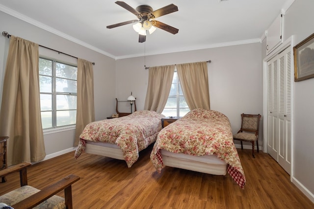 429 W 4th St, Flatonia, TX 78941 - bedroom with wood finished floors, crown molding, a closet, and ceiling fan