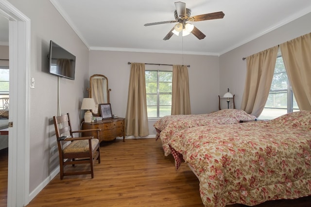 429 W 4th St, Flatonia, TX 78941 - bedroom with wood finished floors, crown molding, and a ceiling fan