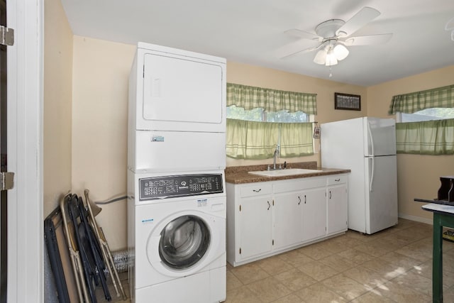 429 W 4th St, Flatonia, TX 78941 - laundry room featuring stacked washer and clothes dryer and a ceiling fan