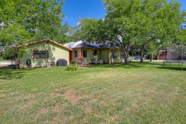 429 W 4th St, Flatonia, TX 78941 - view of front of property featuring a trampoline and a front yard