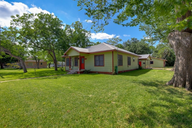 429 W 4th St, Flatonia, TX 78941 - view of front of property featuring a front yard and a metal roof