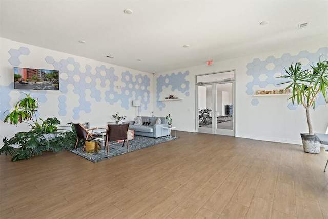 4361 S Congress Ave Unit 435, Austin, TX 78745 - living area with wallpapered walls and wood finished floors