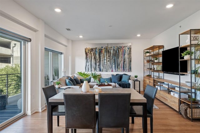 4361 S Congress Ave Unit 435, Austin, TX 78745 - dining room featuring wood finished floors and recessed lighting